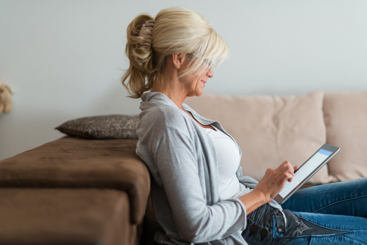 A woman researching the benefits of getting a deferred annuity.