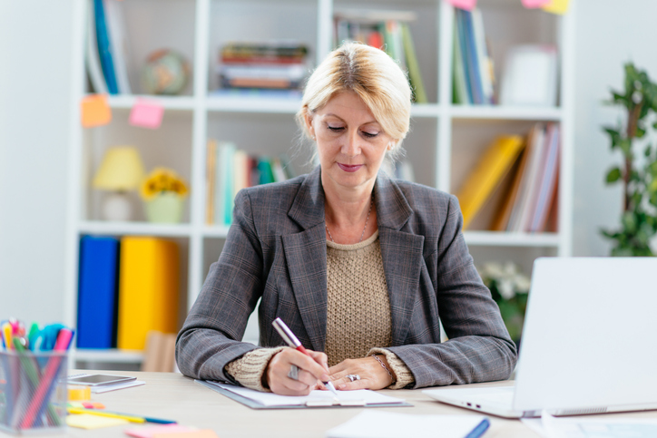 A woman preparing paperwork for a power of attorney in Texas.