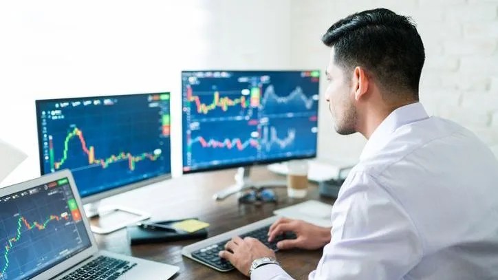 A day trader monitors the markets.