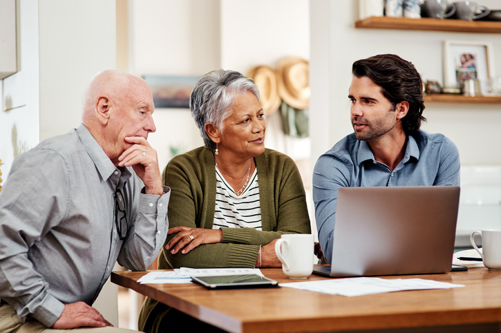 A senior couple meeting with an advisor to review their financial plan and create an estate plan.