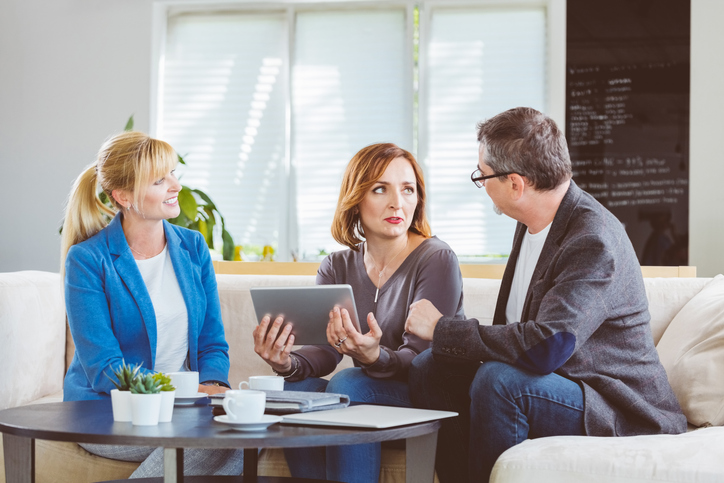 An advisor with a financial psychology certification helping clients identify habits that influence their finances.