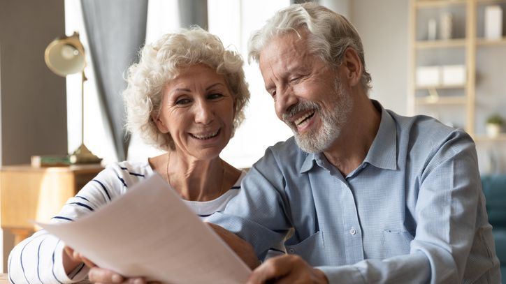 A couple looks over their assets while deciding whether to complete a Roth IRA conversion.