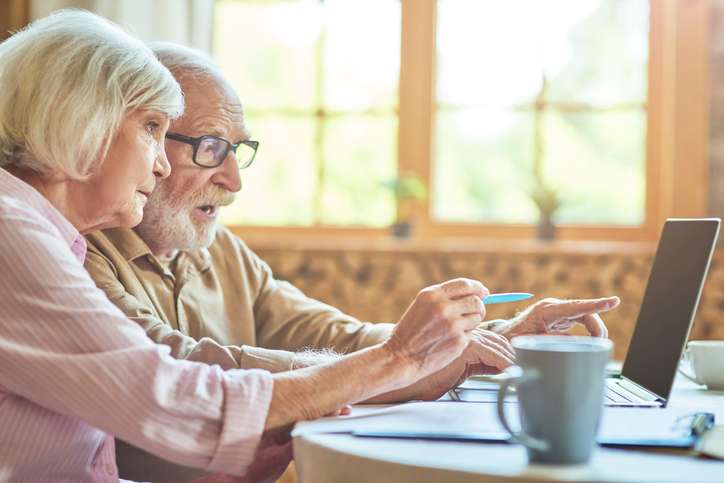 A senior couple researching common strategies to avoid probate in Georgia.