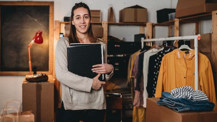 An employee of an estate sale company takes an inventory of items.