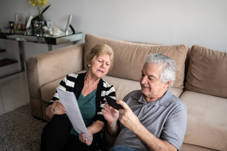 A senior couple reviewing their will in Indiana.