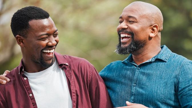 A man shares a laugh with his son after agreeing to help him buy his first home.