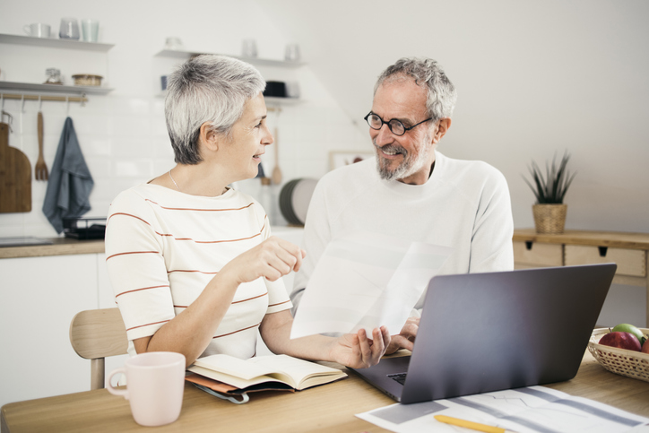A couple reviewing the terms of their 401(k) loan.
