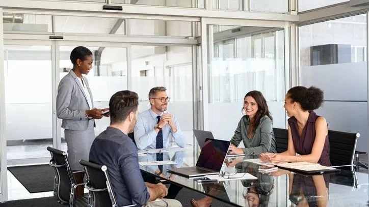 Employees of a registered investment adviser (RIA) sit down for a meeting about the firm's code of ethics.