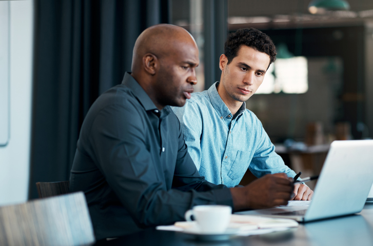Financial advisors reviewing Know Your Client rules for their wealth management firm.