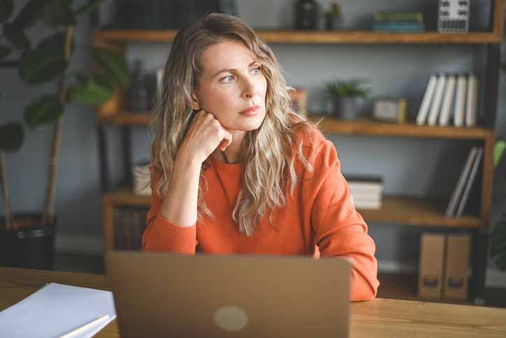 A financial advisor considering the benefits of getting a financial psychology certification to help her clients.