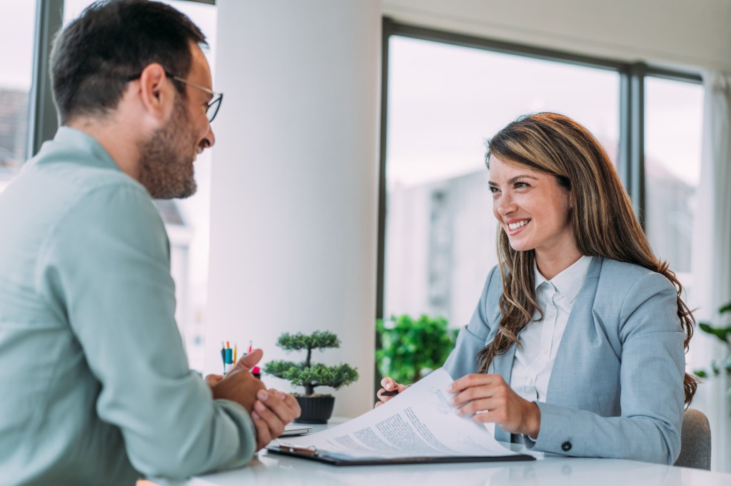 Financial advisors discussing a storyselling strategy.