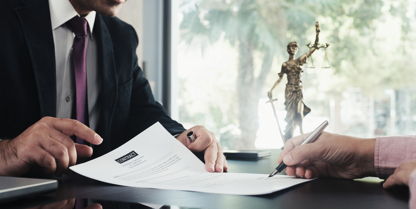 A man establishing a revocable trust with his lawyer in California.