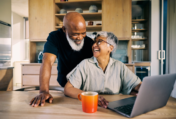 A senior couple looking at how much money they have saved in their health savings account (HSA).