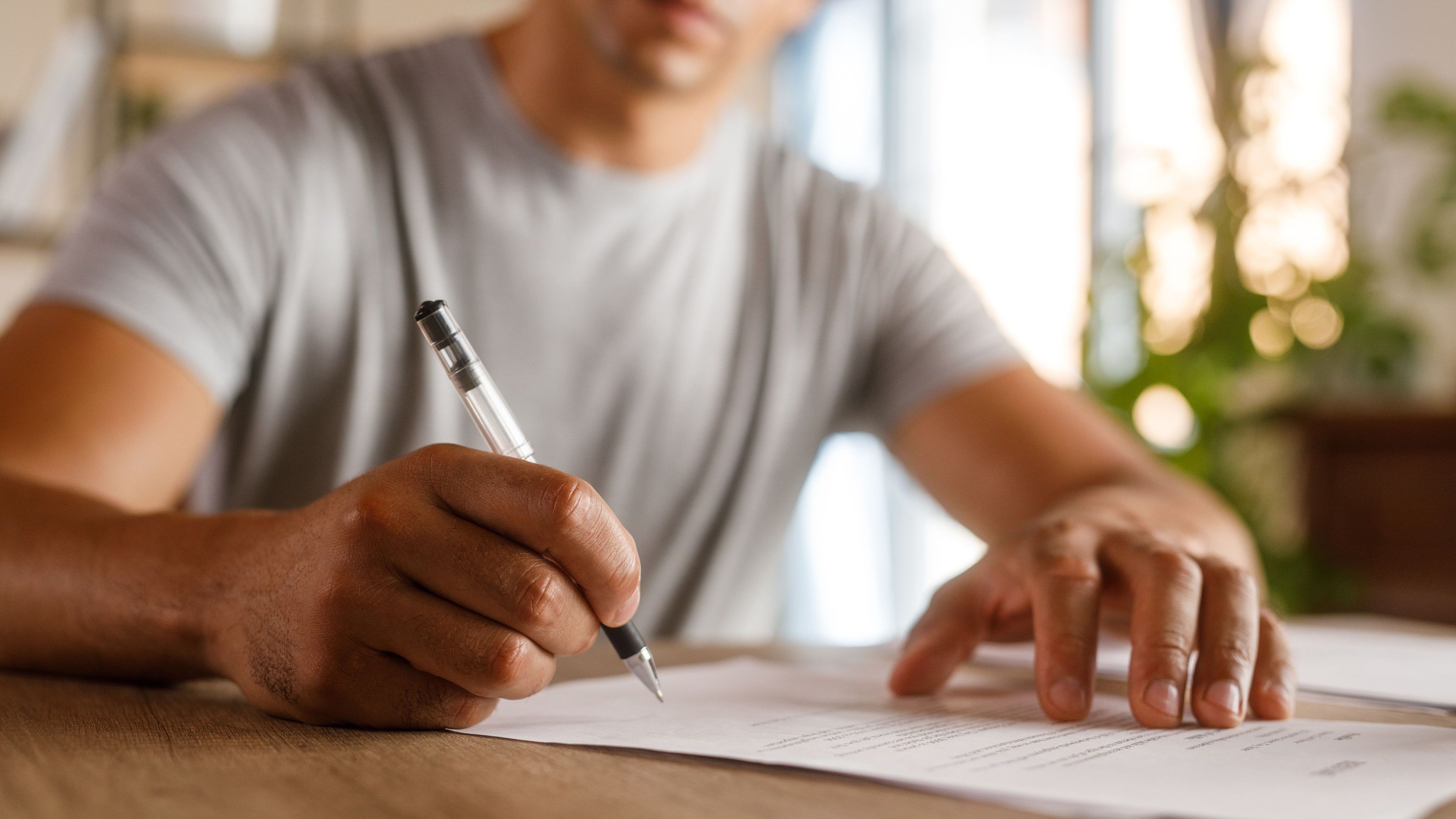 A young father looks over his will, which he created in part of ensure that his children are cared for if he dies suddenly.
