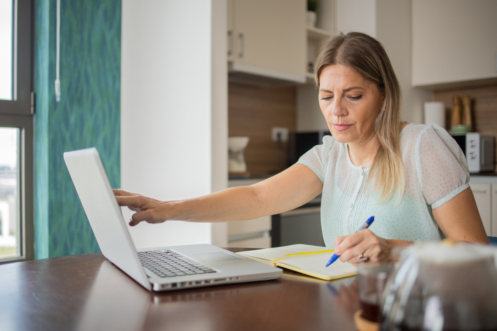 A woman comparing the benefits and drawbacks of using a trust and a will.