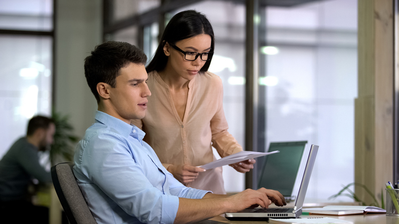 A man researching financial planning resources online.