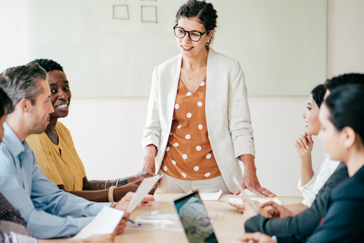 Financial advisors reviewing different financial planning training options.
