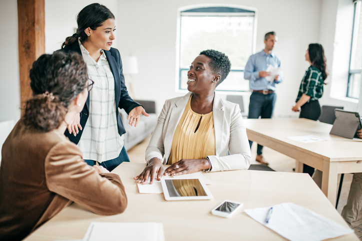 Financial advisors discussing what's included in a financial planning training program.