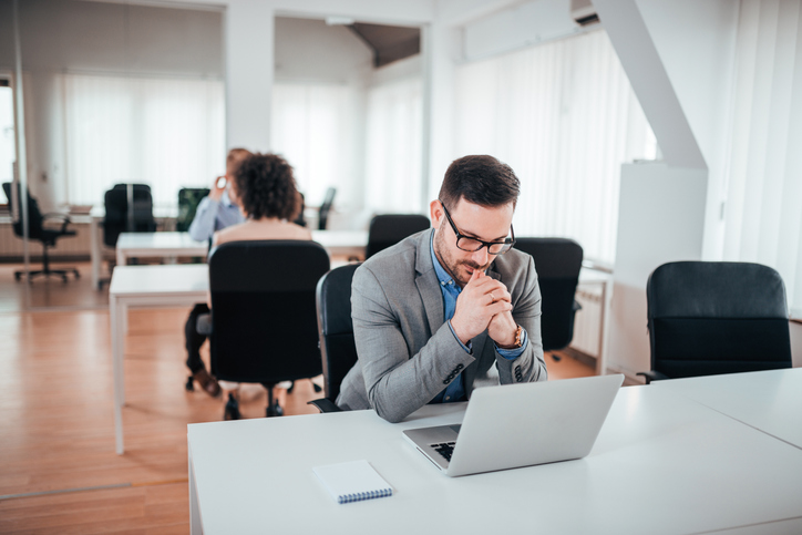 A man reviewing entry level financial planning job descriptions.