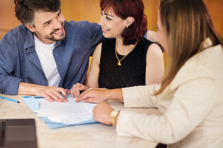 A couple discussing the differences between probate vs. non-probate assets with a financial advisor.