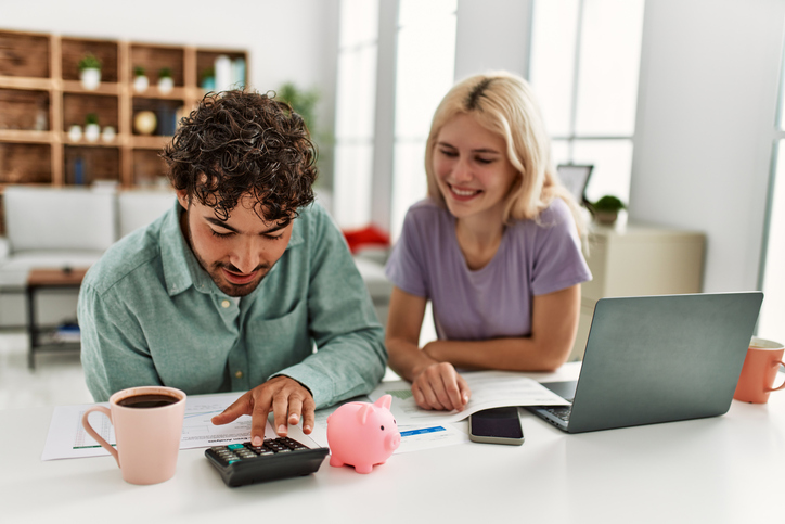 A couple calculating their net investment income tax (NIIT).