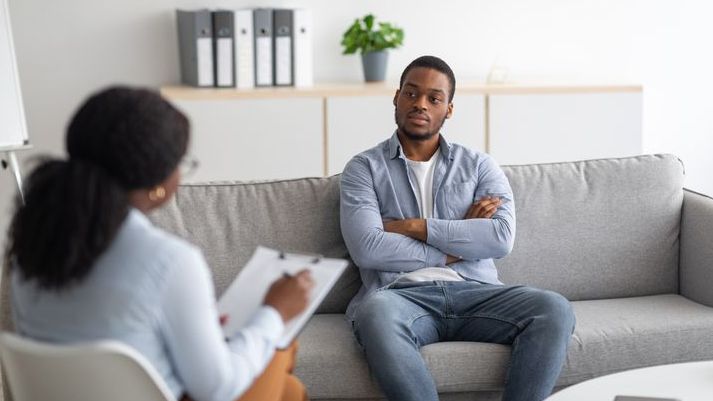 A patient meets with his psychiatrist to talk about his care.