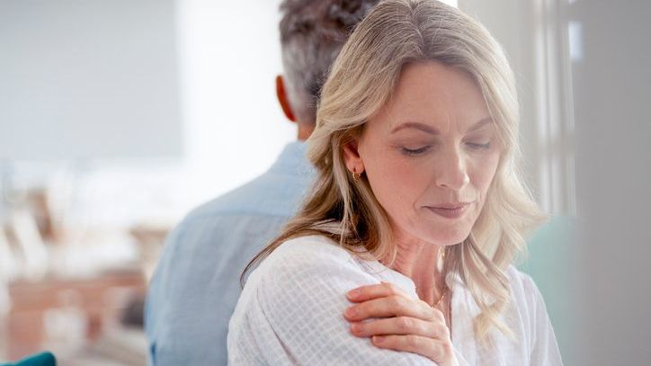 A woman and her husband turn away from each other after discussing a divorce.