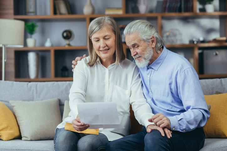 A senior couple preparing documentation to set up a conservatorship in California.