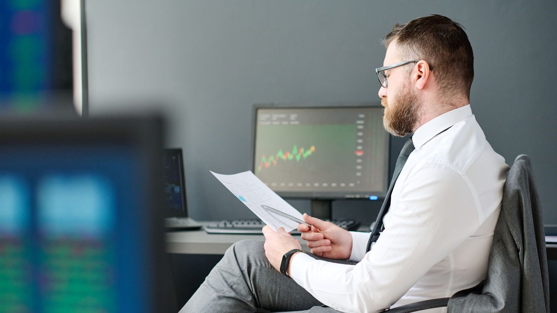 An employee of a large wirehouse looks over the performance of a particular economic sector.