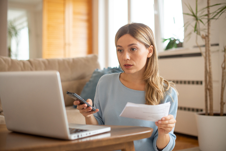 An investment adviser representative looking up mandatory continuing education requirements in her state.