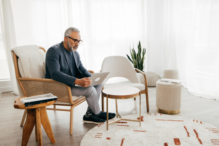 A senior looking up how much it costs to make a will.