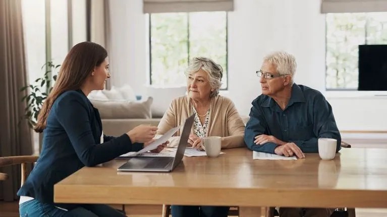 A couple meets with the executor of their estate to discuss their will.
