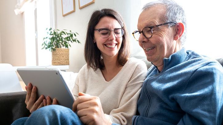 A woman goes over an enhanced life estate deed with her father.