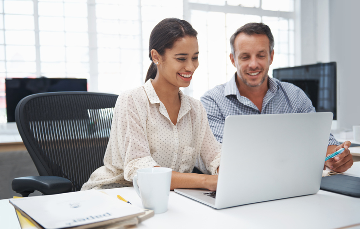 A couple reviewing an estate plan checklist that includes creating a will and a trust in New Jersey.