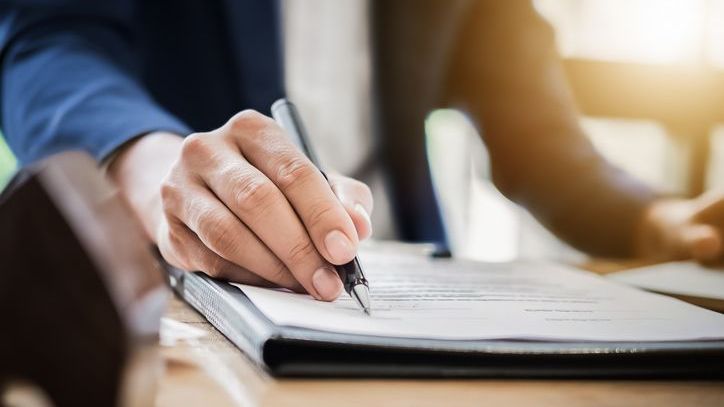 An executor reviewing the will of a deceased.