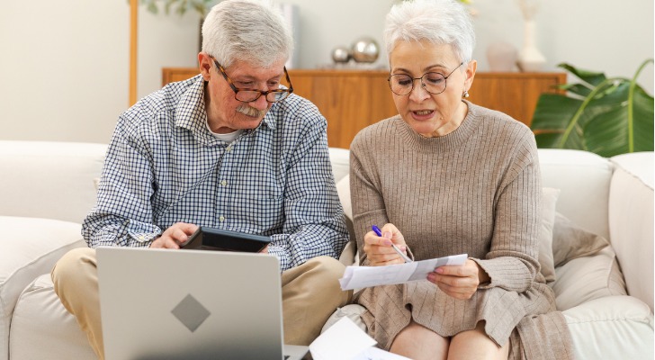A retired couple looks over how much one of their retiree reimbursement arrangement (RRA) offers in reimbursements.