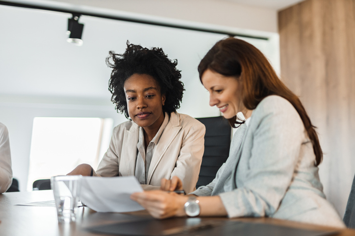 A woman reviewing her estate plan, which includes a conservatorship for a family member, with a financial advisor.