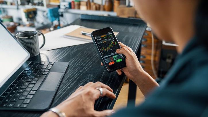 An investor monitors a high-value stock that he's interested in buying using fractional shares.