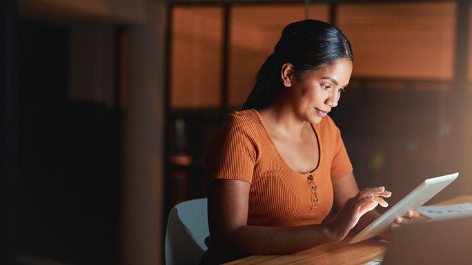 A woman reviews some investment options for her IRA.