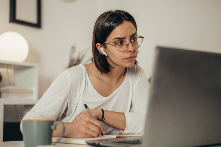 Woman looking for sample questions to prepare for the CFP® exam.