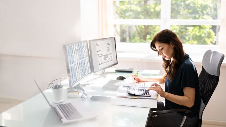 A financial advisor looks over data while developing her advisory practices for a client avatar.