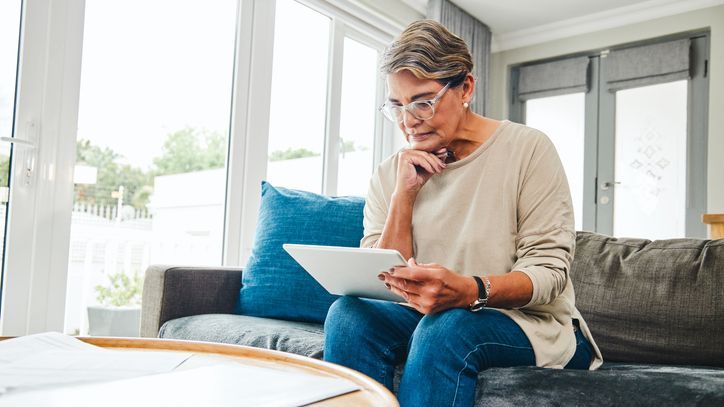 A woman who has inherited a $550,000 IRA from her father looks over the account paperwork.