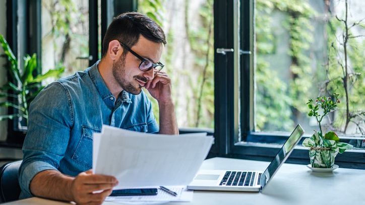 A man looks over his options for variable universal life insurance policies.