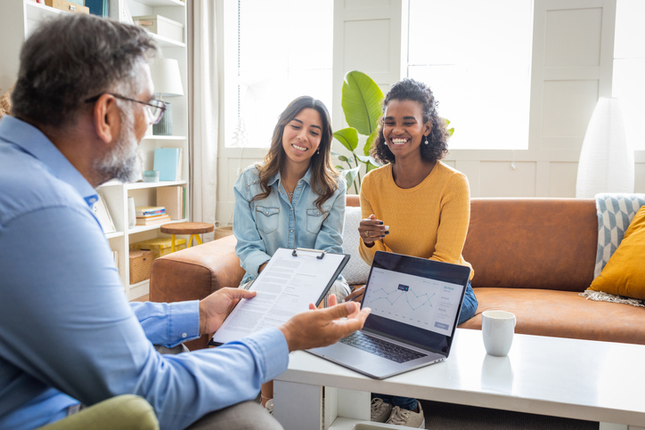 Clients discussing risk tolerance after answering a questionnaire for their advisor.