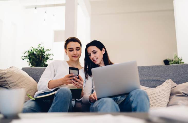 Two investors comparing how much they are paying in investment fees.