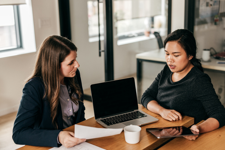 A woman consulting a divorce attorney in Florida about alimony.