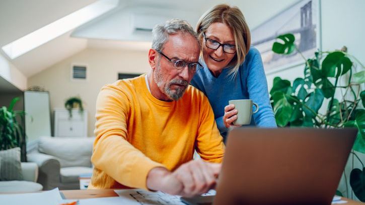 A couple weighs the tax impact of withdrawing a large sum of money from their IRA.