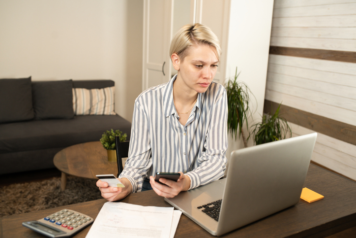 A woman researching how much it costs to create a living trust in California.