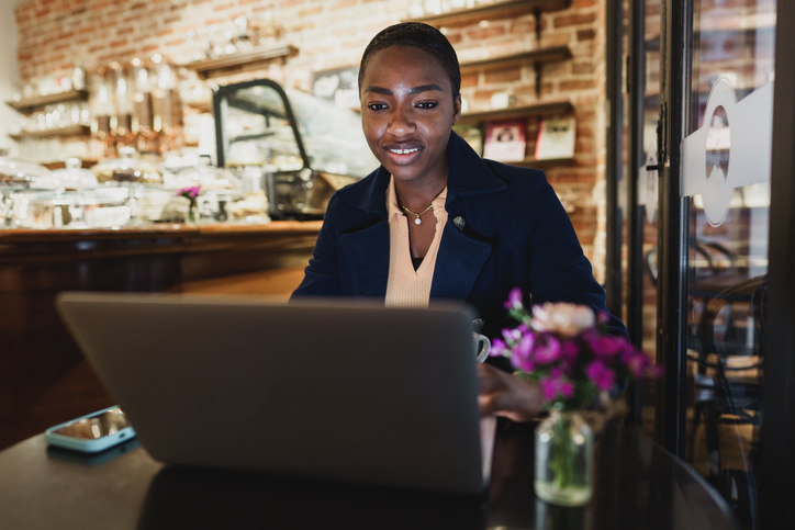 A woman looking up the costs of creating a living trust in New York.