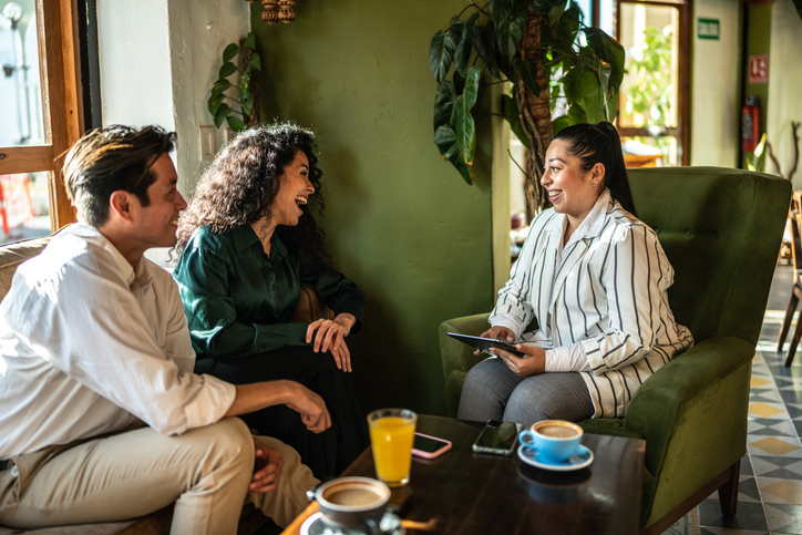 A financial advisor reviewing a risk tolerance questionnaire with clients.